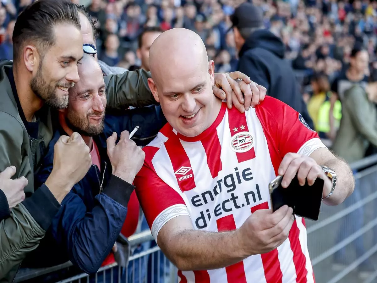 Fans with World Champion Darts Michael van Gerwen (R) during the game PSV - Feyenoord .