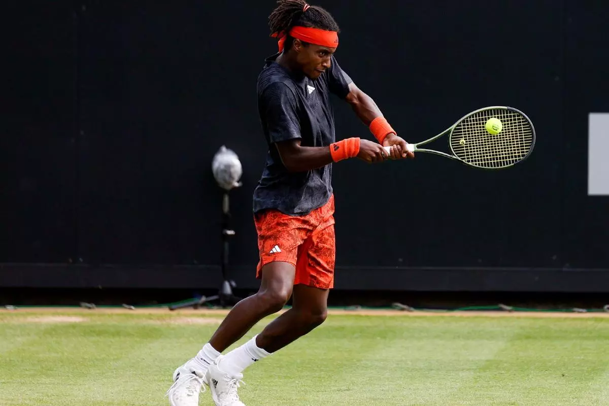 Mikael Ymer plays a backhand at the Rothesay International Eastbourne - July 2023