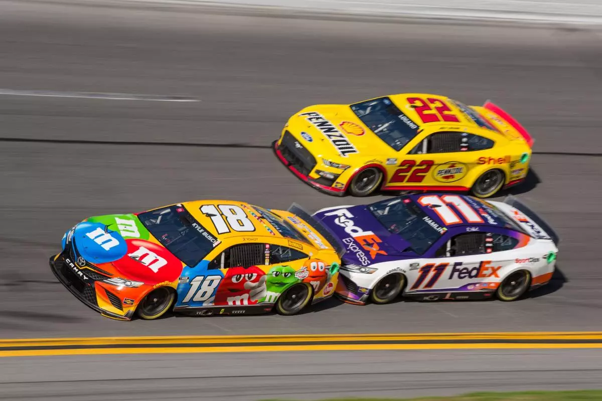 Kyle Busch and Denny Hamlin battle for the lead