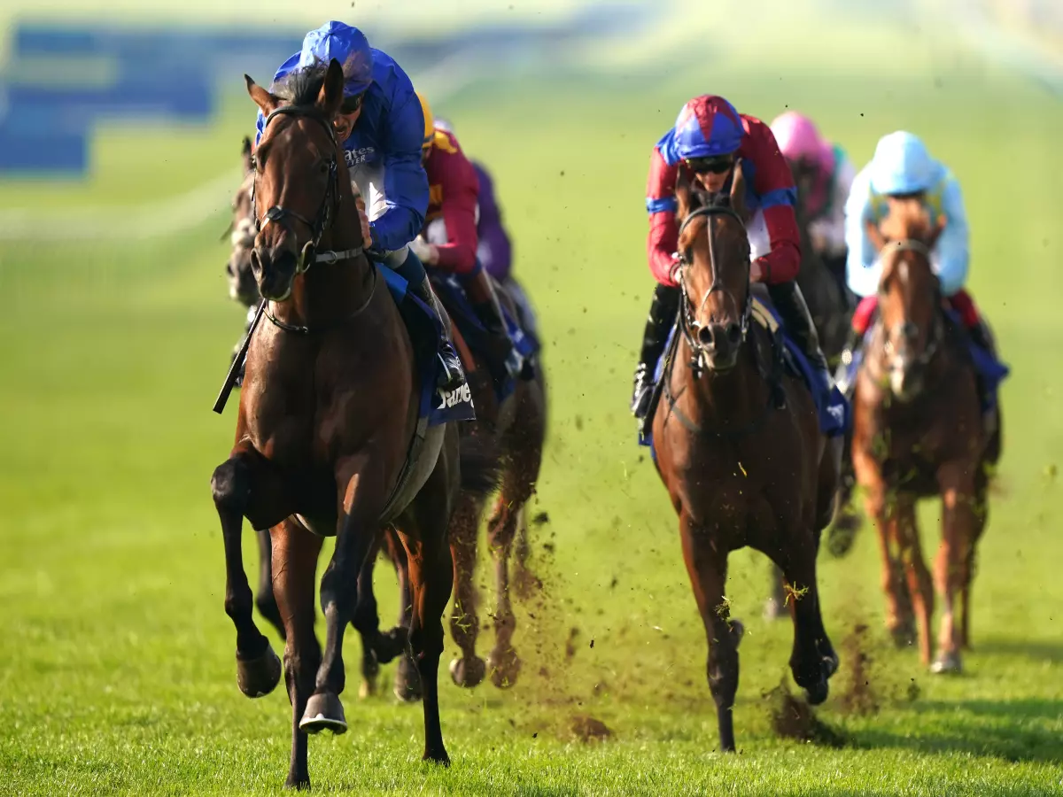 William Buick riding Native Trail (left) on their way to winning the the Darley Dewhurst Stakes at Newmarket Racecourse