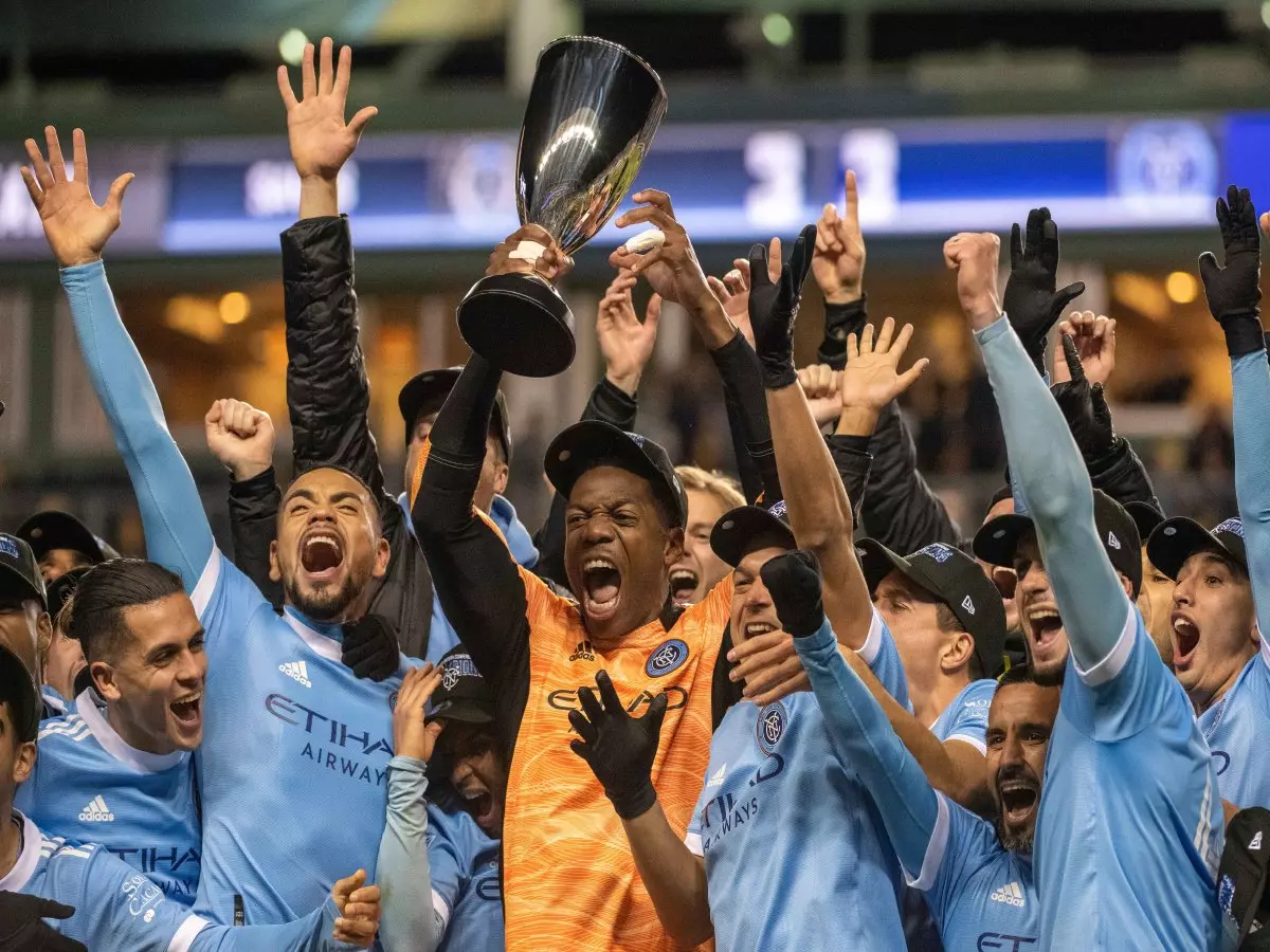 New York City FC goalkeeper SEAN JOHNSON #1 lifts the trophy during the MLS Eastern Conference Finals
