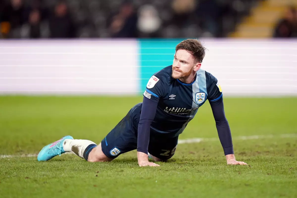 Ollie Turton is set for a spell on the sidelines and will miss Huddersfield's clash with Sunderland