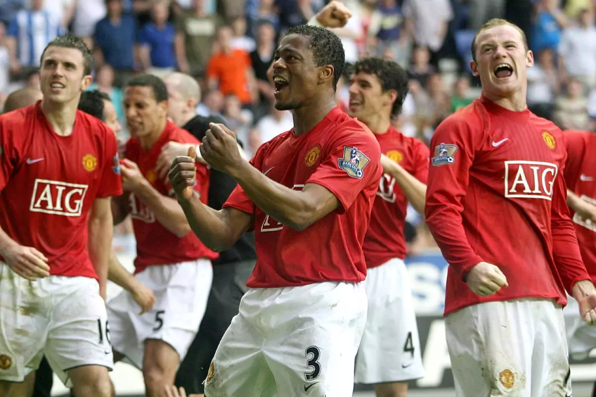 Patrice Evra and Wayne Rooney celebrate Ryan Giggs' goal against Wigan May 2008