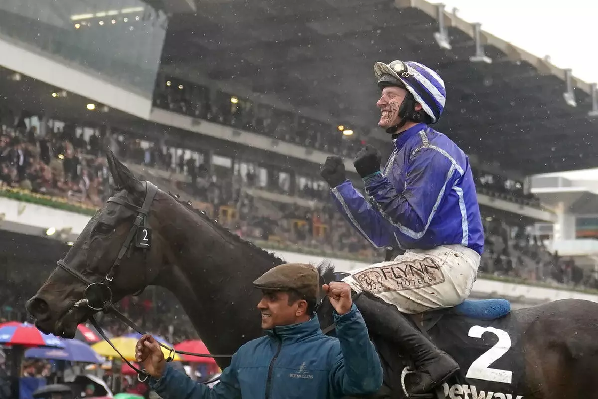 Paul Townend celebrates winning Champion Chase on Energumene at Cheltenham