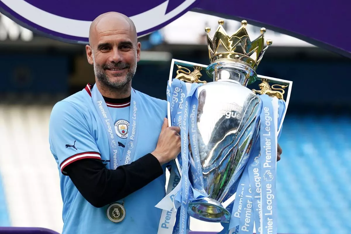 Pep Guardiola with Premier League trophy 21 May 2023