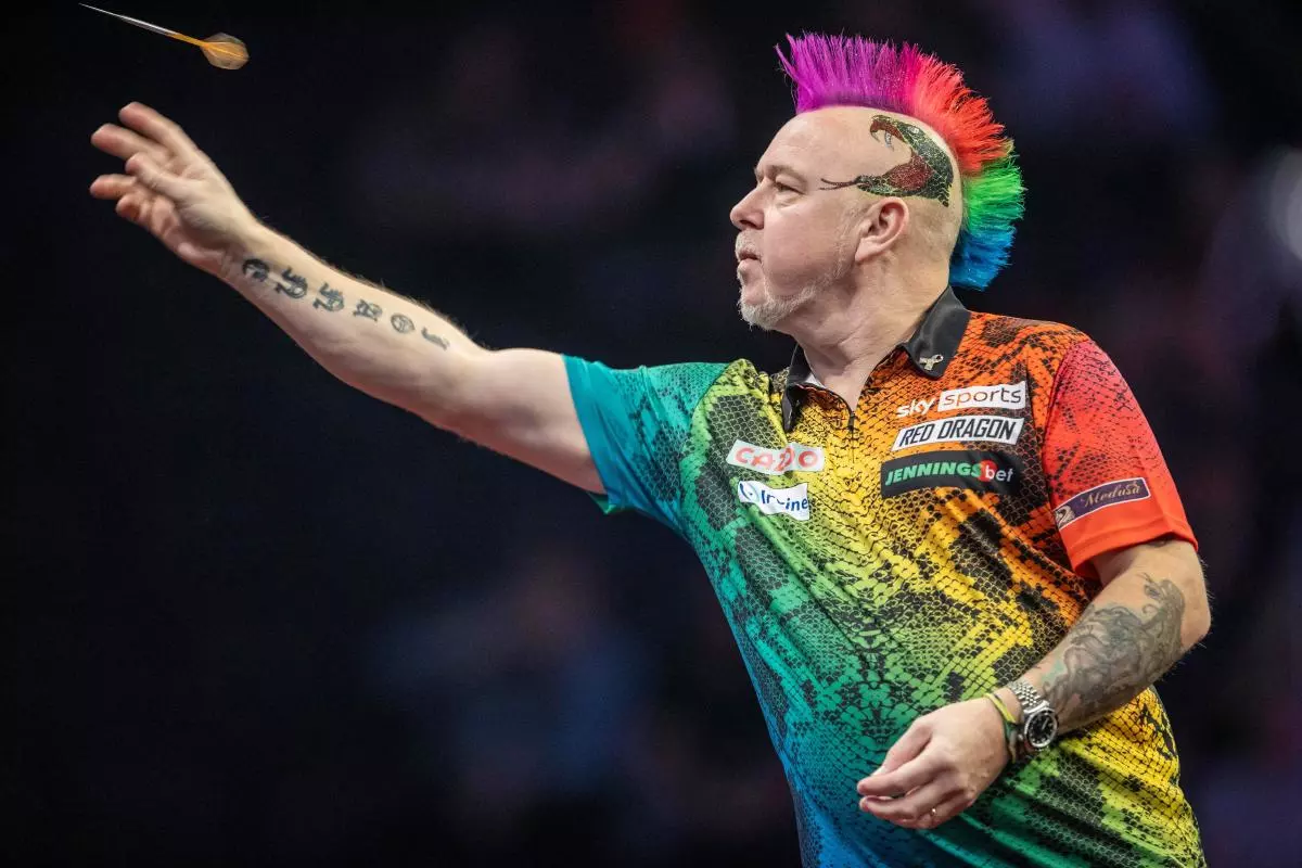Peter Wright throws his dart