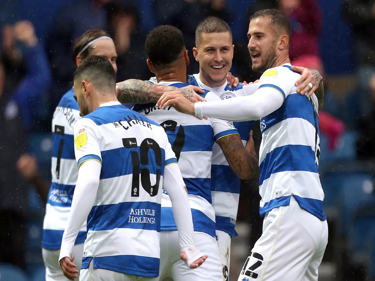 Queens Park Rangers' Lyndon Dykes (centre right) celebrates scoring their side's first goal of the game during the Sky Bet Championship match at the Kiyan Prince Foundation Stadium, London.