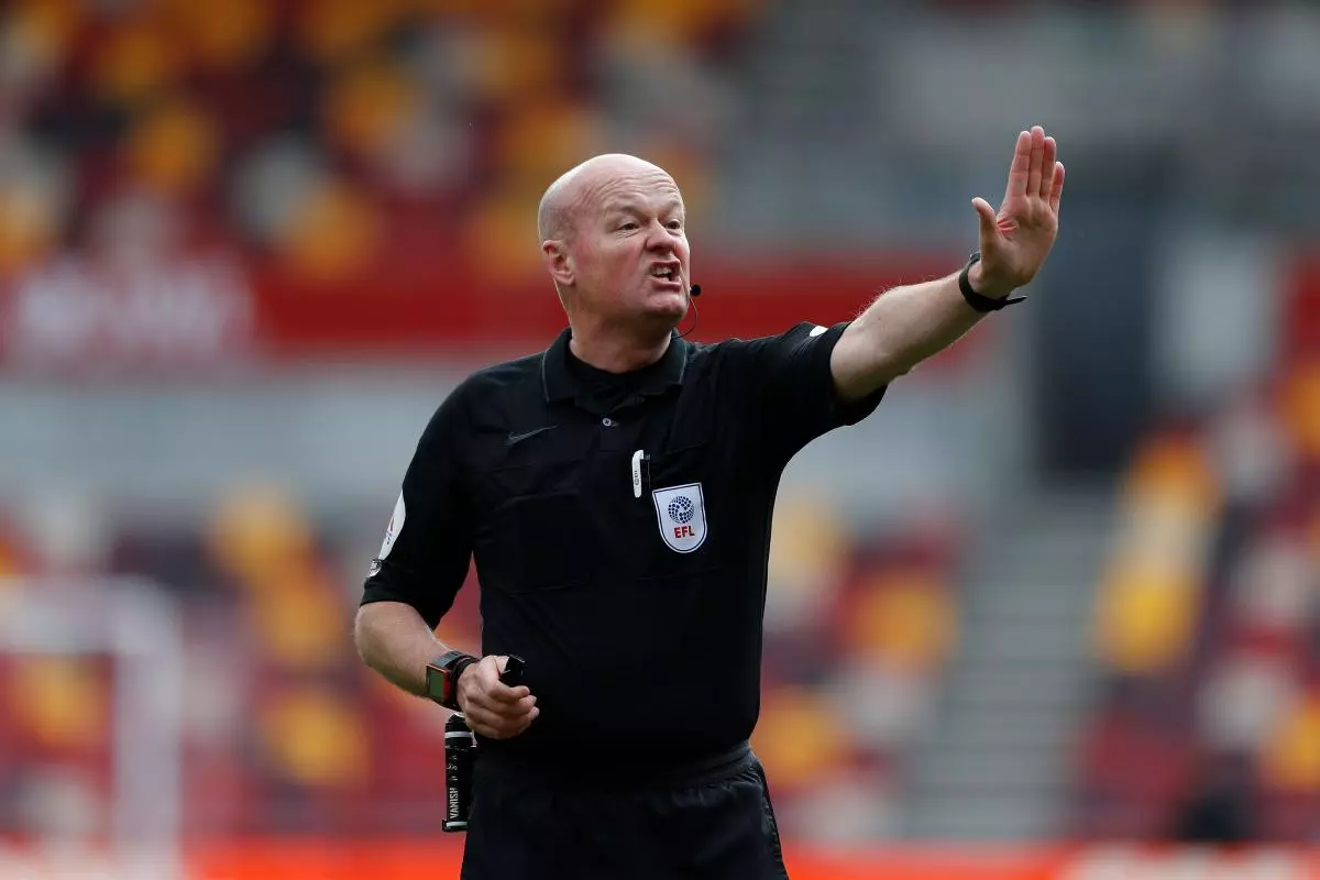 Referee Lee Mason makes his decision