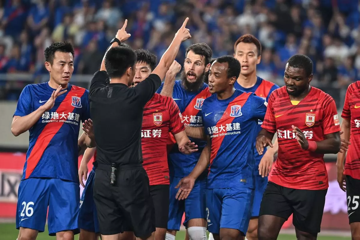 Players argue with referee