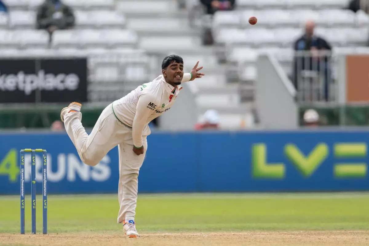 Rehan Ahmed bowling for Leicestershire during a County Championship match against Derbyshire