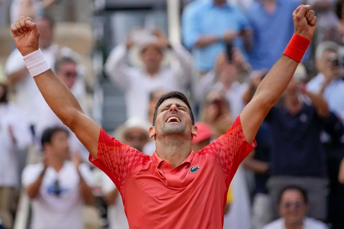 Serbia's Novak Djokovic celebrates winning the men's singles final match of the French Open