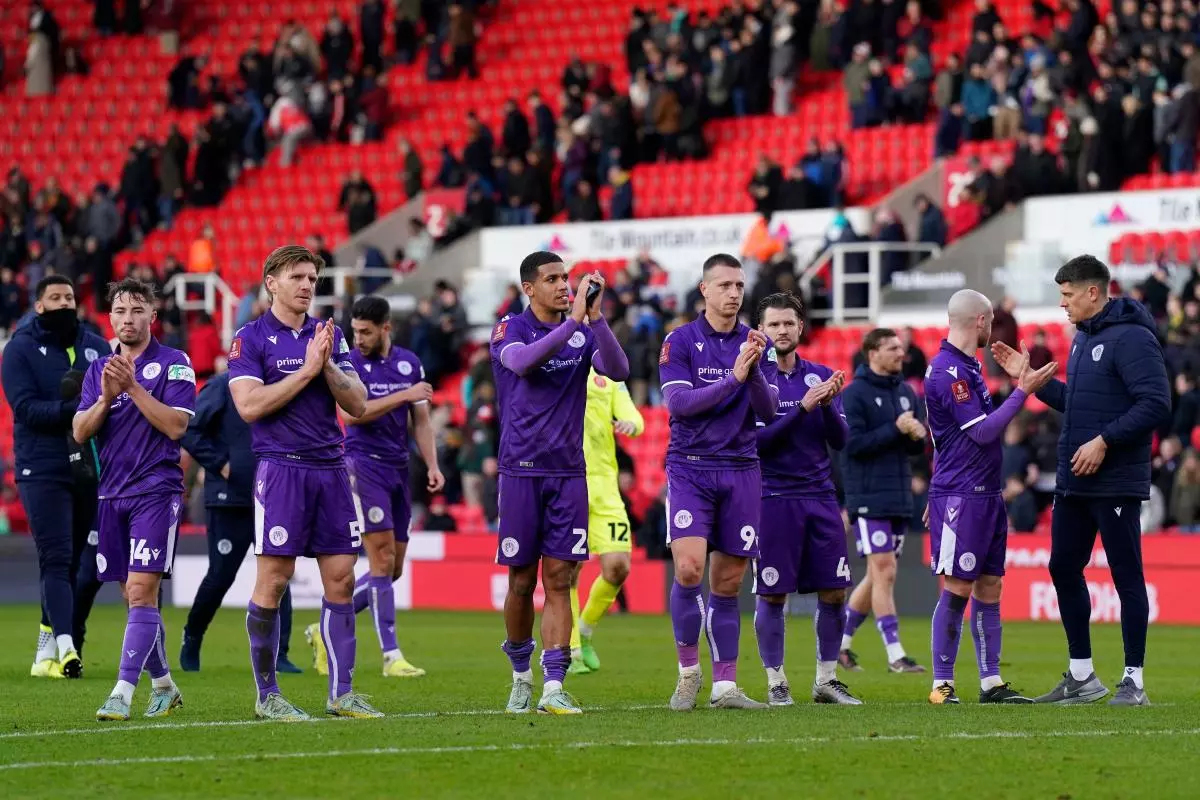 Stevenage players applaud their fans
