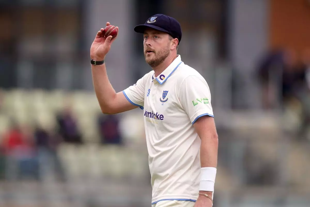 Sussex's Ollie Robinson acknowledges the crowd whilst holding up the ball after taking seven wickets in Worcestershire's first innings - May 2023