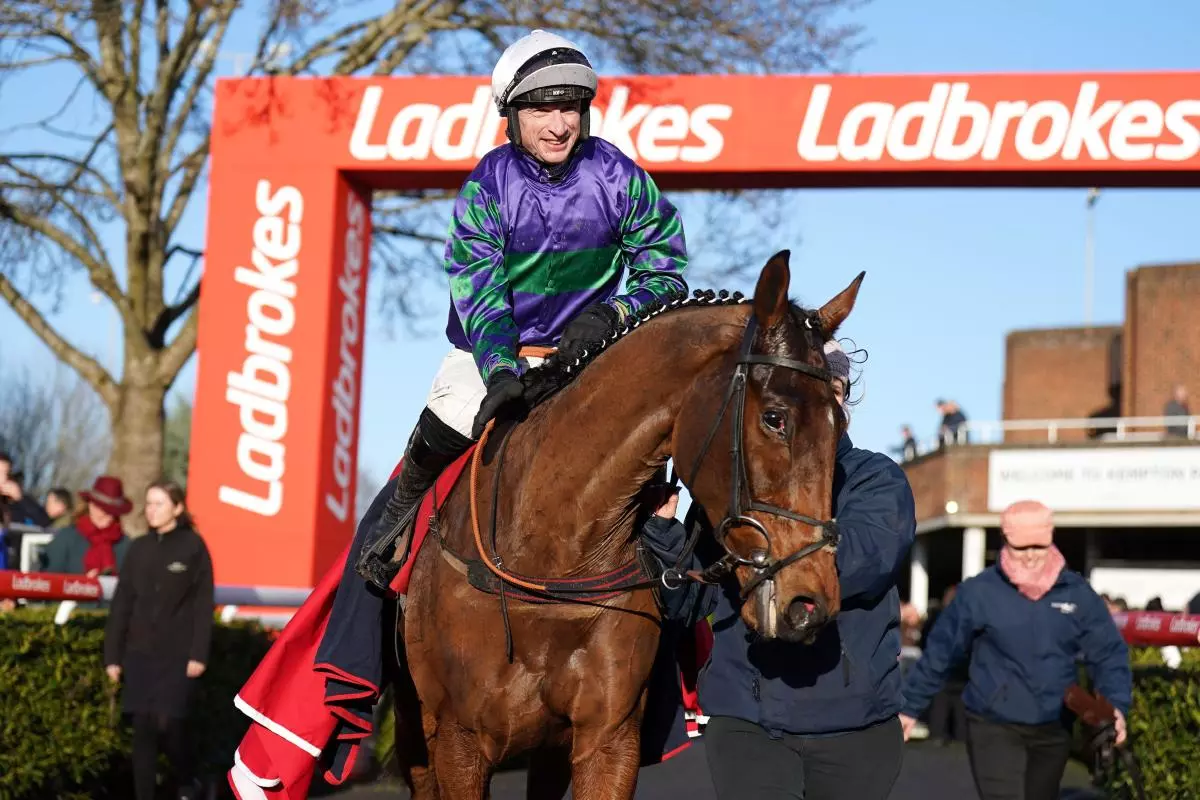 Tom O'Brien celebrates winning The Ladbrokes Kauto Star Novices’ Chase on Thyme Hill at Kempton