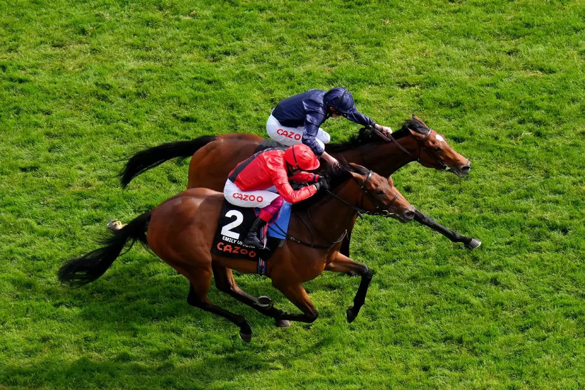 Tuesday ridden by Ryan Moore beats Emily Upjohn and Frankie Dettori to win Epsom Oaks