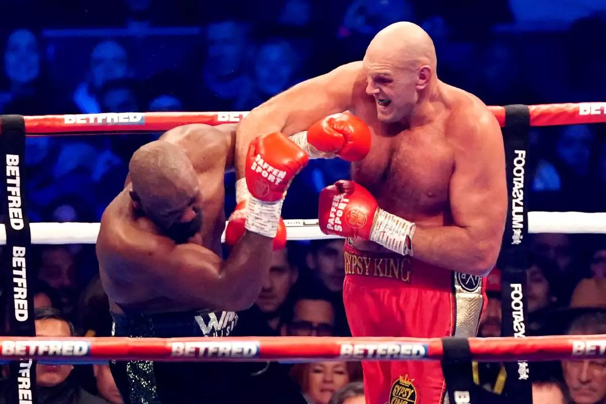 Tyson Fury in action against Derek Chisora