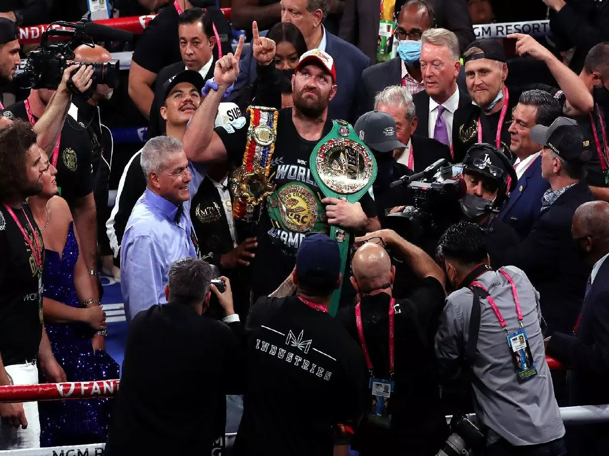 Tyson Fury celebrates defending his WBC heavyweight title
