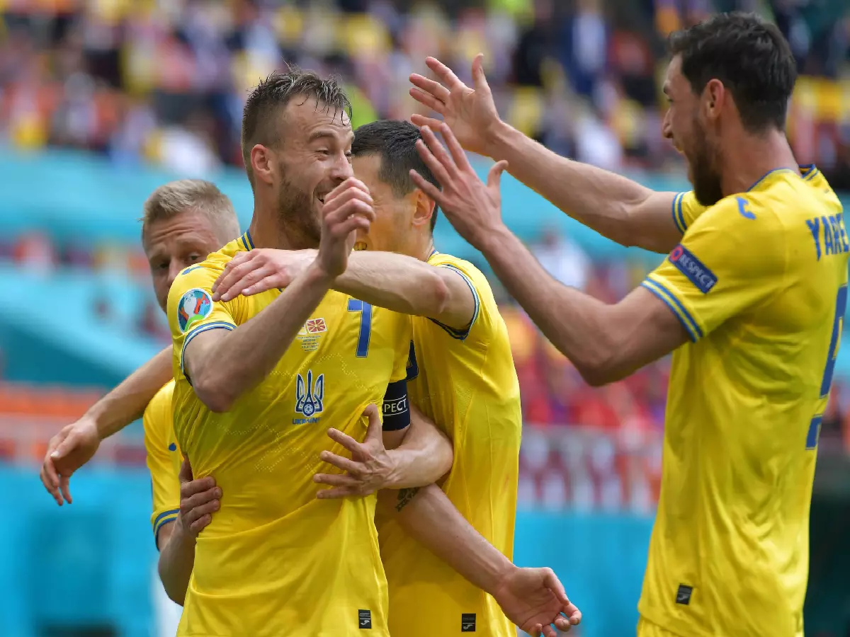 Ukraine players celebrate as Andriy Yarmolenko opens the scroing