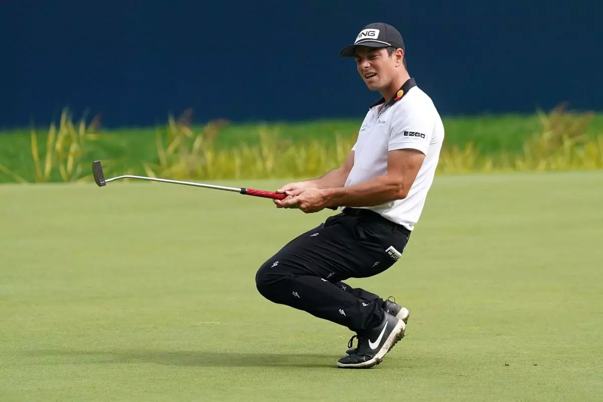 Viktor Hovland reacts on the 18th green during day three of the BMW PGA Championship at Wentworth Golf Club