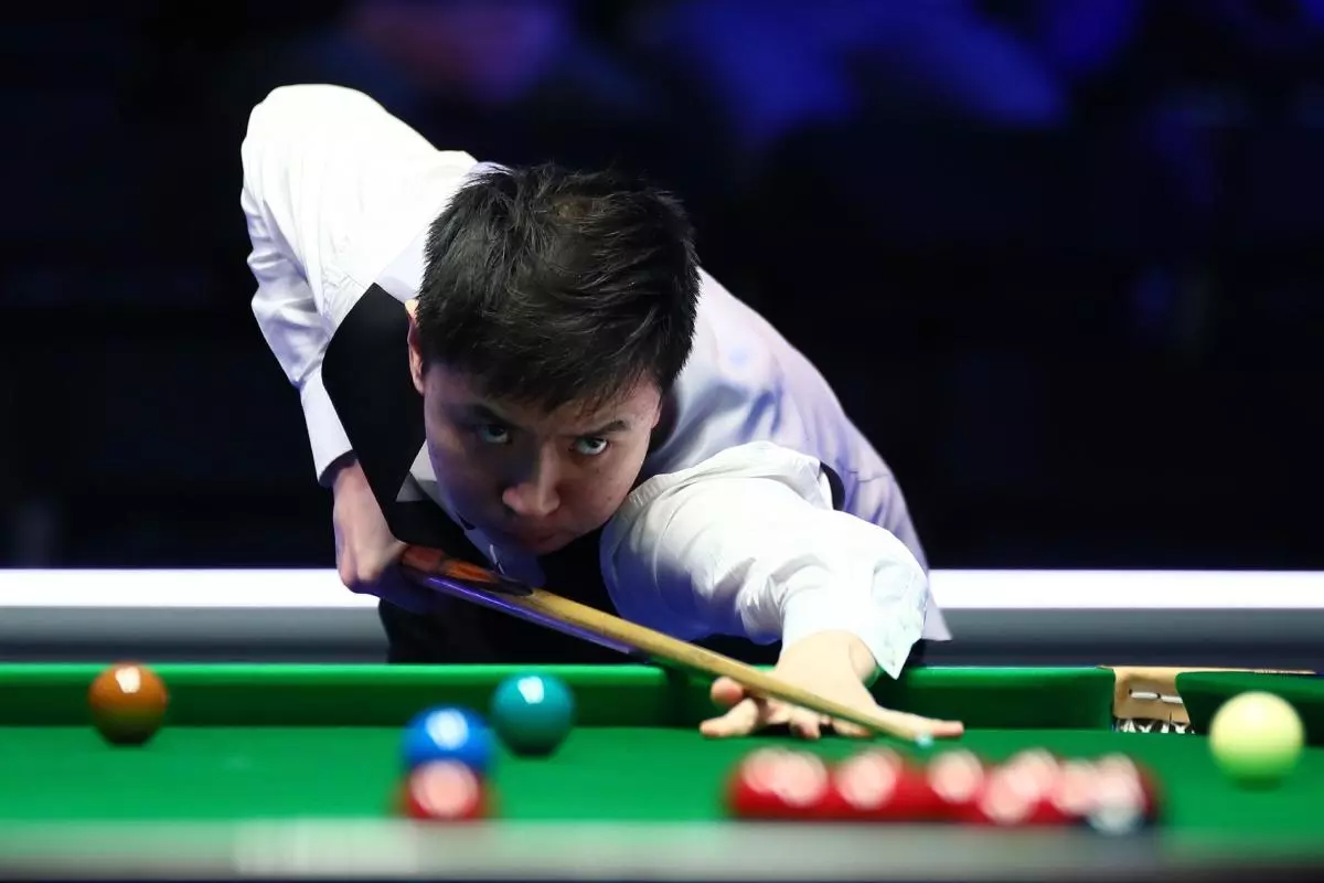 Xiao Guodong of China plays a shot
