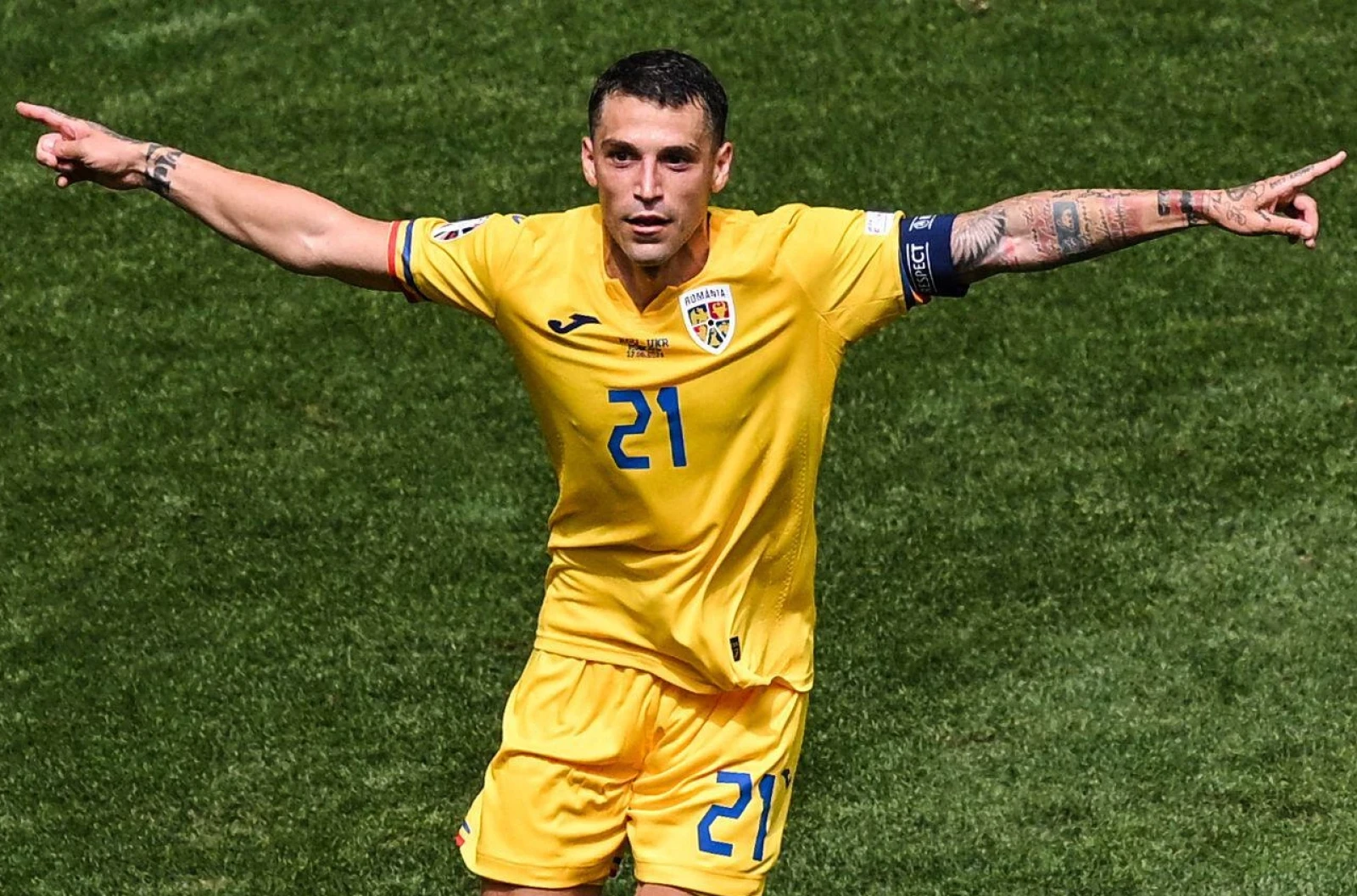 Romania's Nicolae Stanciu scores at Euro 2024