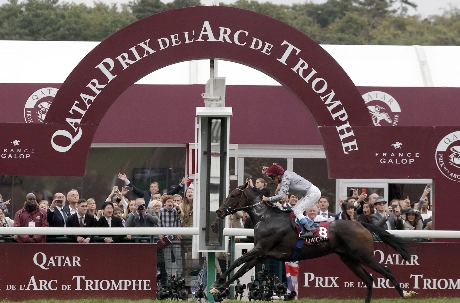 Thierry Jarnet riding Treve crosses the finish line to win the Qatar Prix de l'Arc de Triomphe at Paris Longchamp
