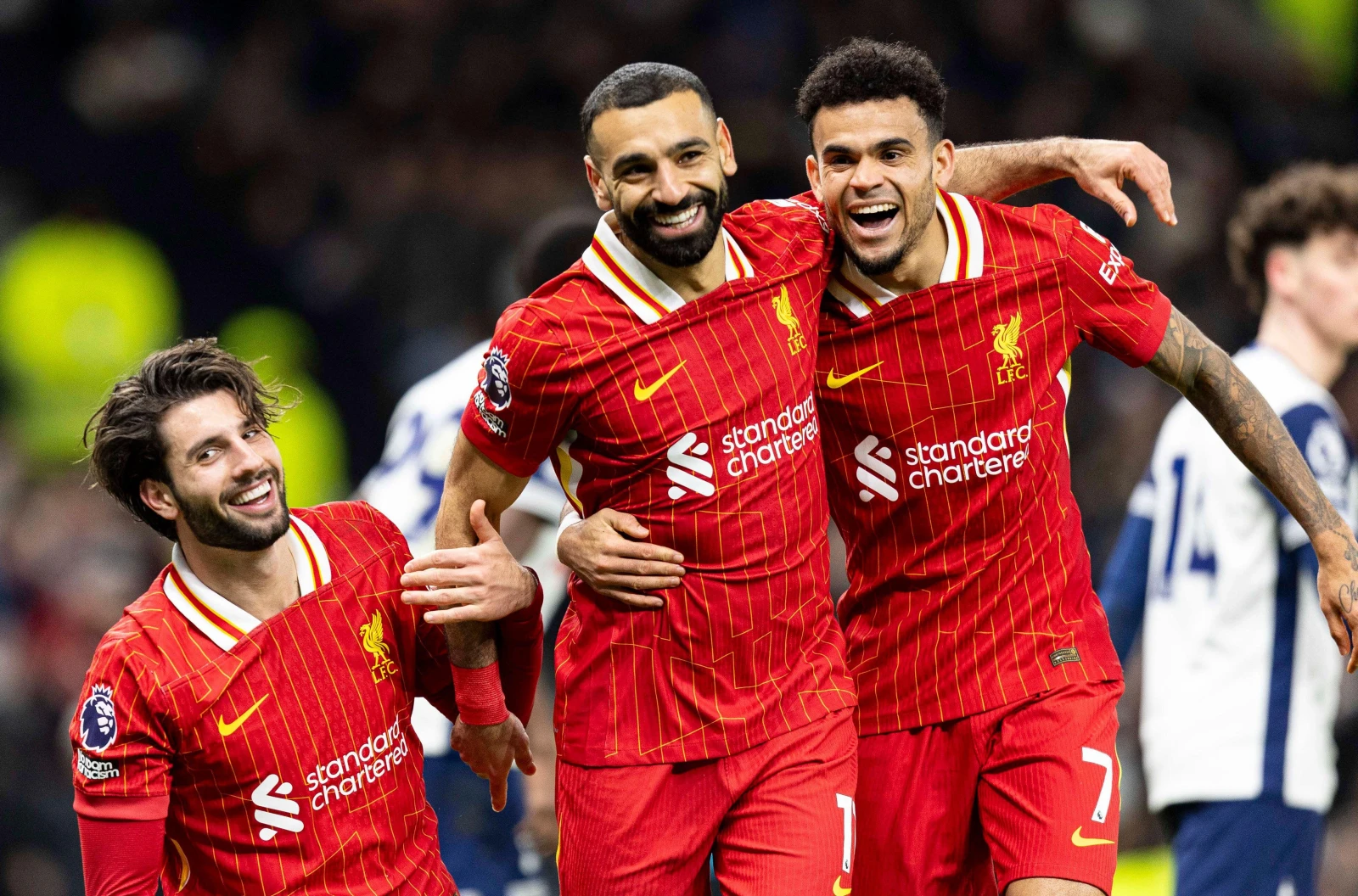 Mohamed Salah of Liverpool (C) celebrates with teammate Luis Díaz
