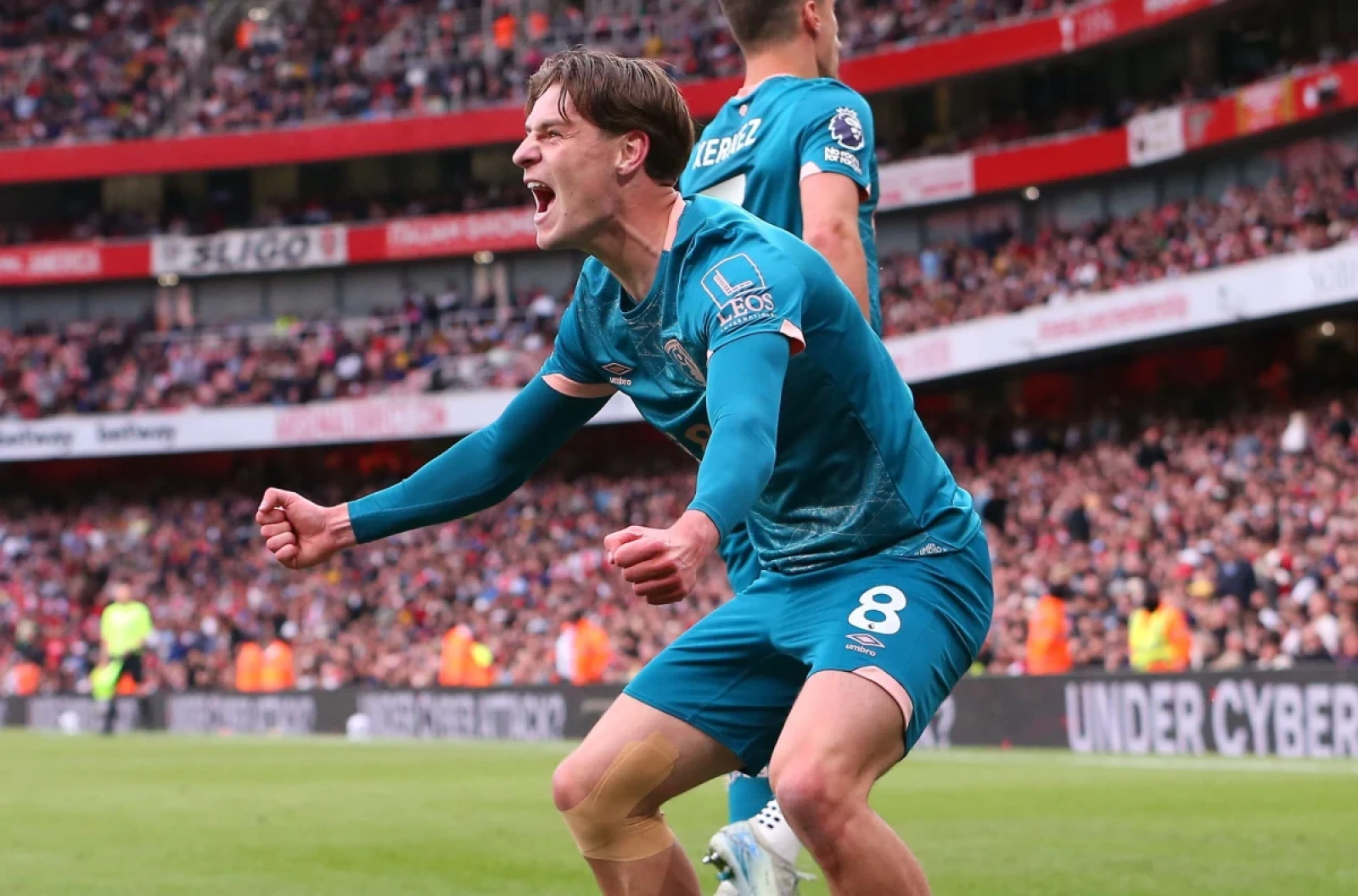 Bournemouth's Alex Scott celebrates a goal at the Emirates