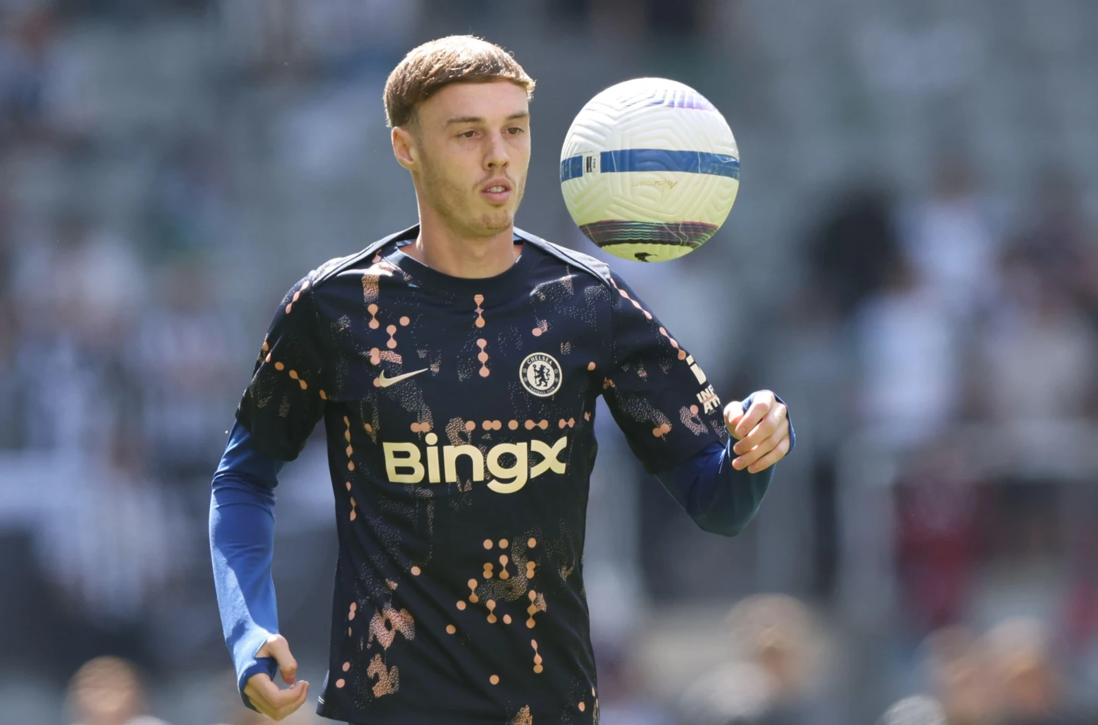 Cole Palmer of Chelsea warms up during a Premier League match