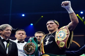 Oleksandr Usyk after retaining his WBA, WBC, WBO, IBO World Heavyweight championship belts against Tyson Fury in their rematch