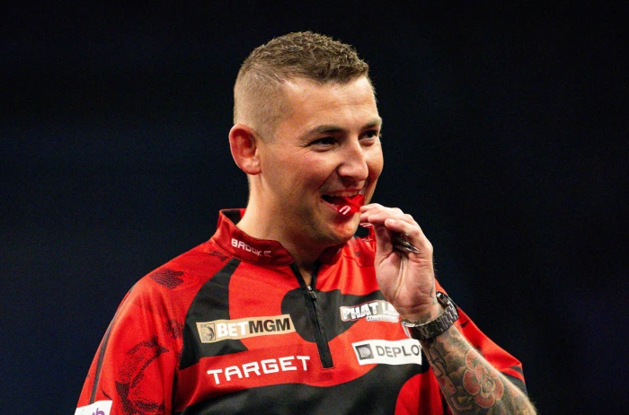 Nathan Aspinall in action at the Premier League Darts