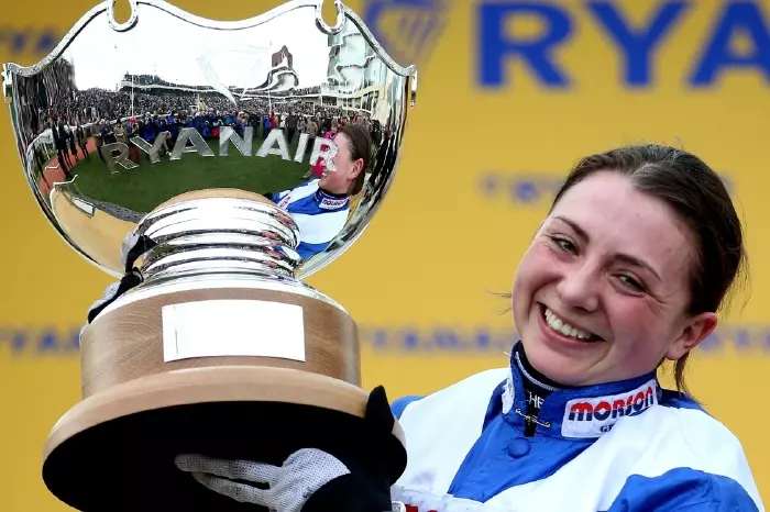 Jockey Bryony Frost lifts the Ryanair Chase trophy after winning the Cheltenham Festival race on Frodon