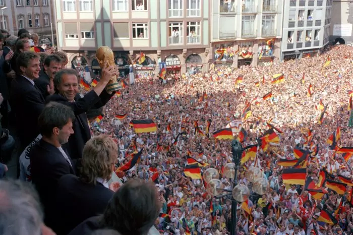 Germany and their fans celebrate with the World Cup trophy in 1990