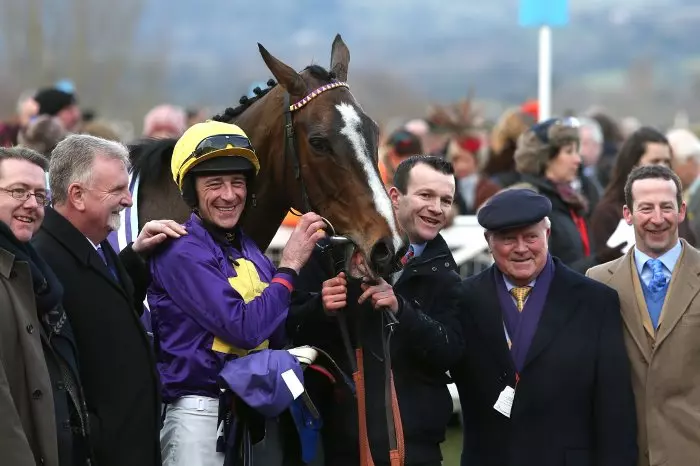 Jockey Davy Russell celebrates victory on Lord Windermere with winning connections including Lord Windermere with Tom Doyle (far left), Peter Dooley (centre right) and trainer Jim Culloty (fa
