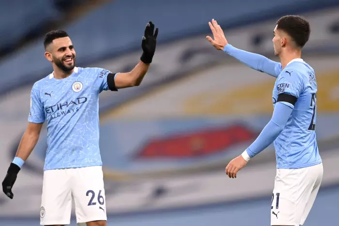 Riyad Mahrez and Phil Foden celebrate a Manchester City goal