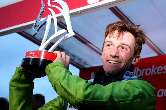 Sam Twiston-Davies with the winner's trophy after his 2019 King George win on Clan Des Obeaux