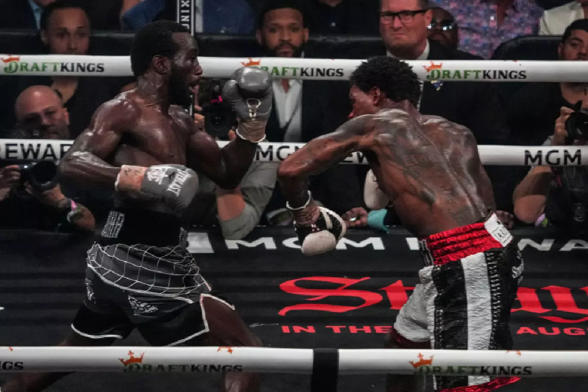 Terence Crawford makes history with TKO victory over Errol Spence Jr