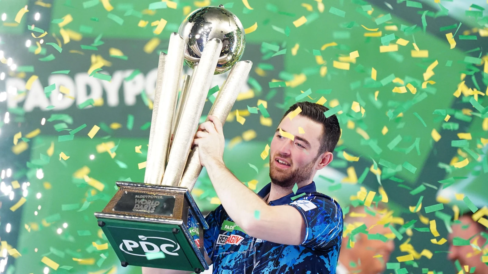 Luke Humphries wins first World Darts Championship after reeling in