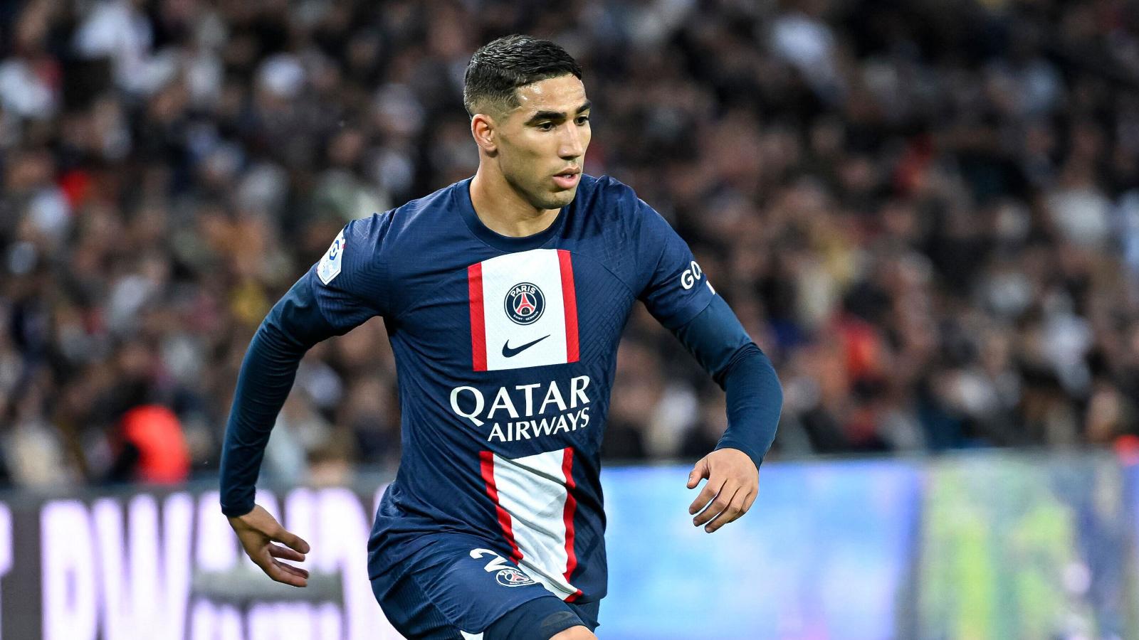  Achraf Hakimi, a right-back for Paris Saint-Germain, controls the ball during a match.